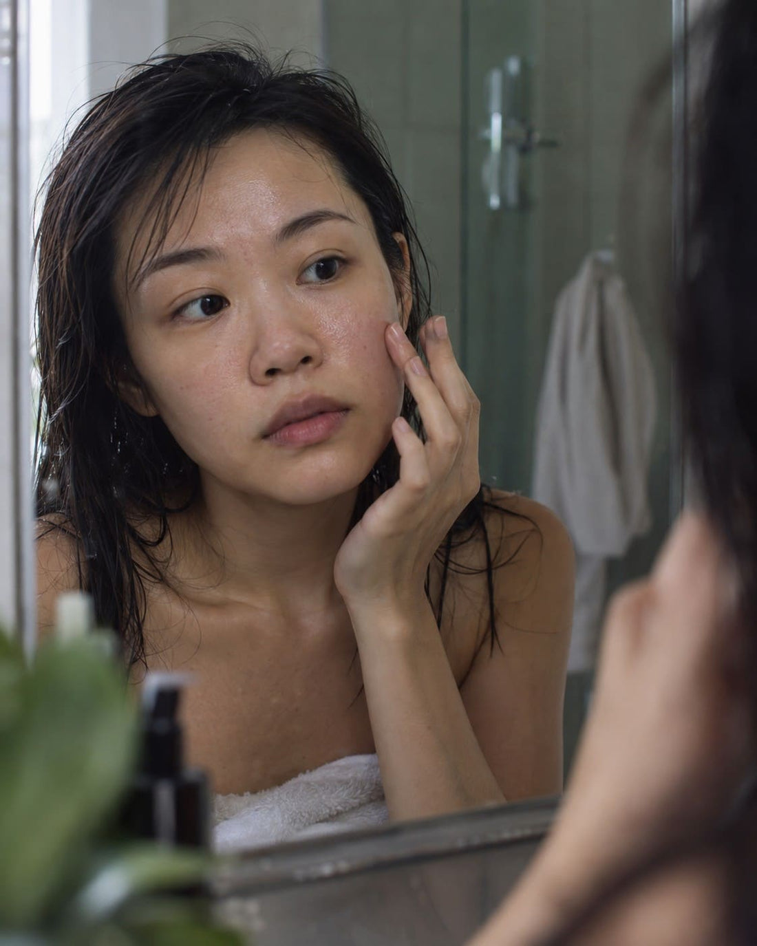 Woman with oily dehydrated skin and visible shine on the T-zone